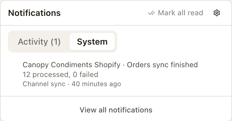 The bell's System tab: one finished channel sync, already read