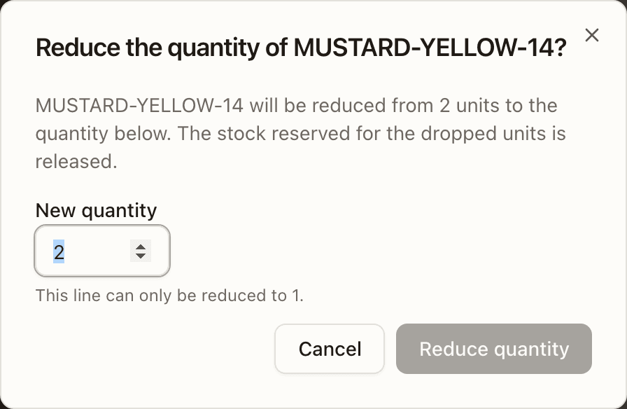 The Reduce the quantity of MUSTARD-YELLOW-14? dialog on an allocated order — the released-stock note and the New quantity field