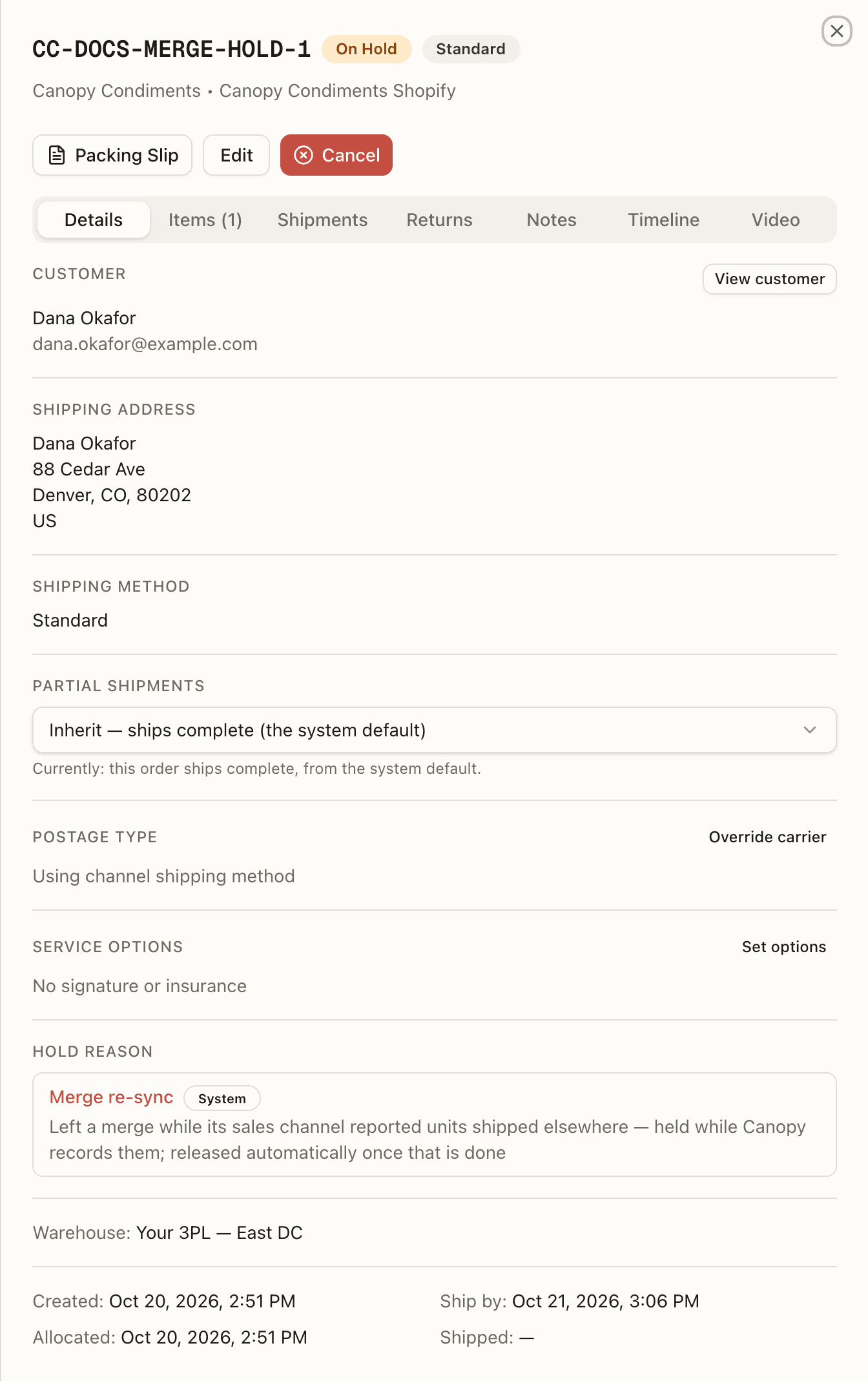An order just taken out of a merge — On Hold, System, with the re-sync hold reason